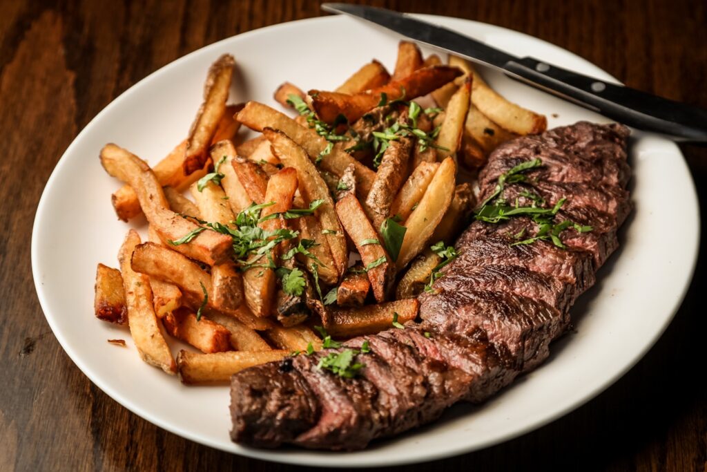 Some beautiful bastard cut up this delightful steak for me to photograph with truffle oil fries on the side. Part of the C9 Work WordPress Theme sample content imagery.
